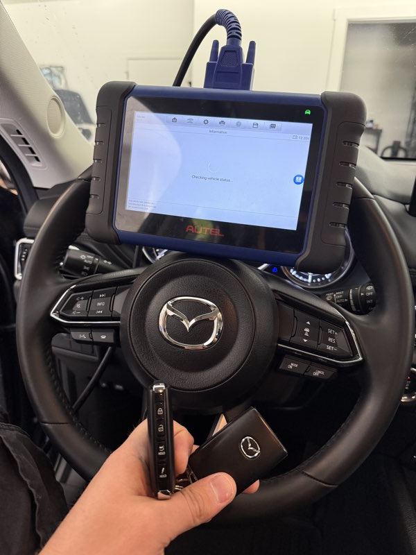 Mazda key programming through the OBD port using a diagnostic tablet